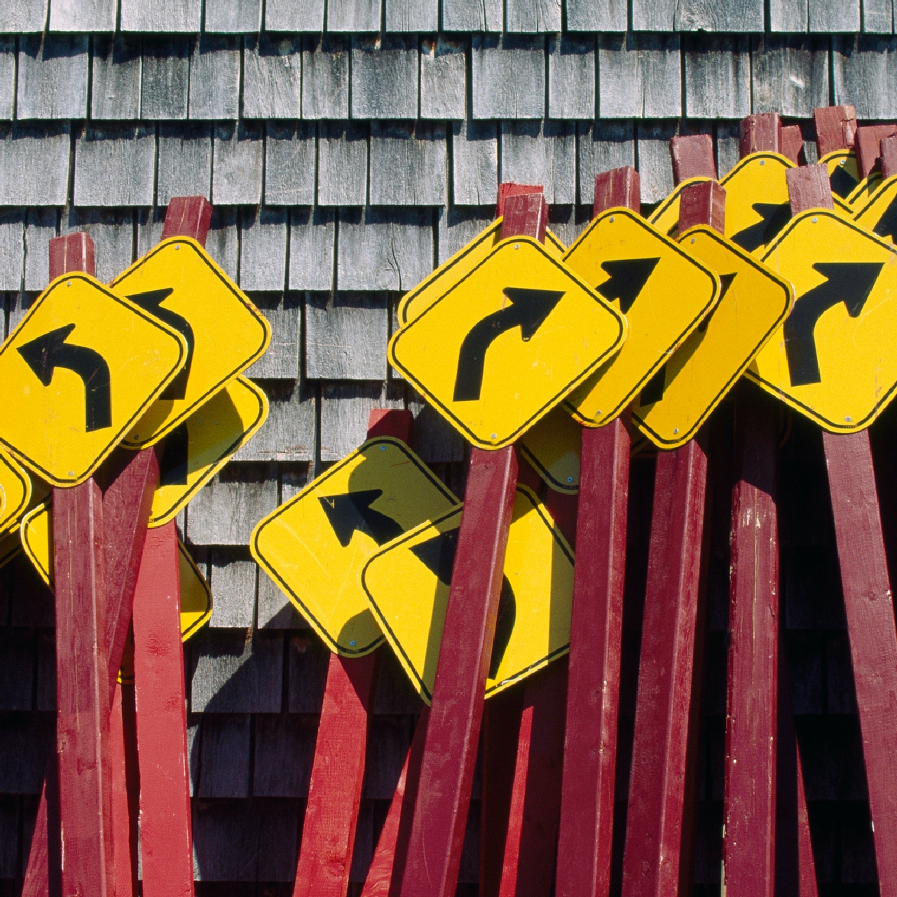 Photo of street signs with arrows pointing in different directions