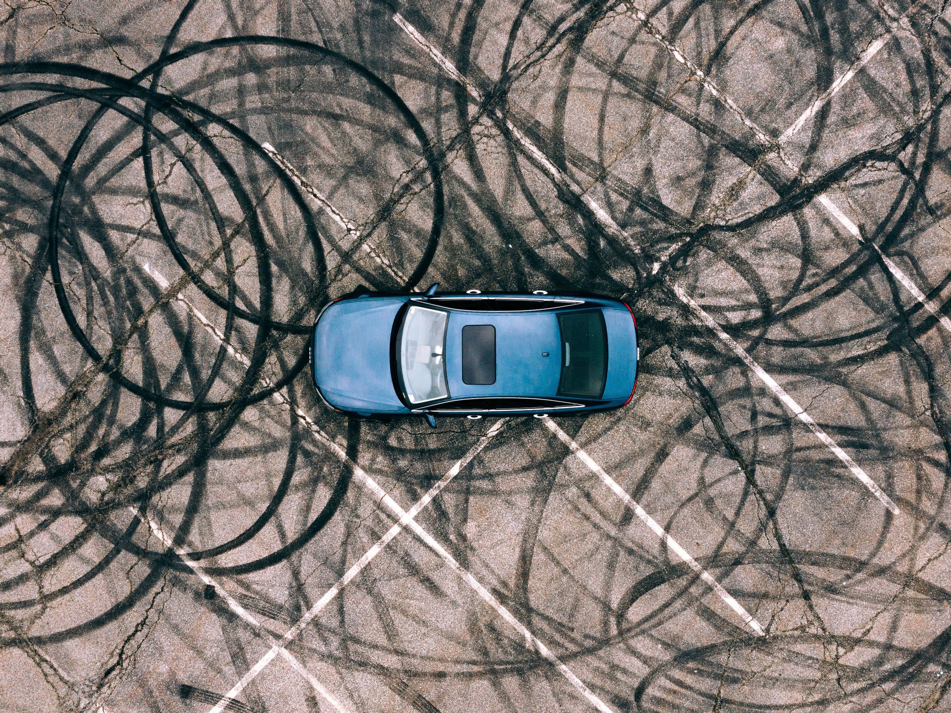 Photo of car with lots of tire marks