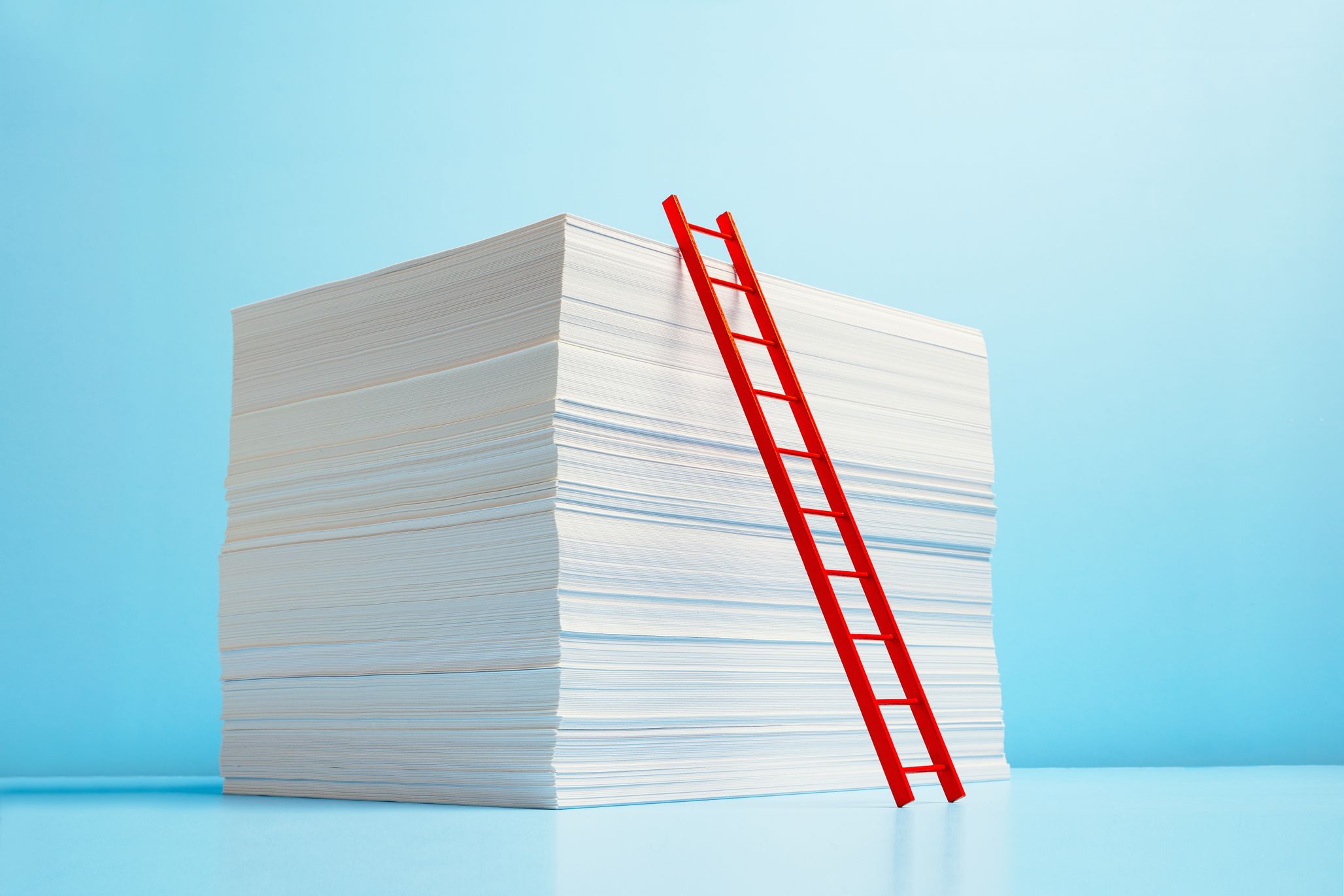 Stack of papers with a ladder